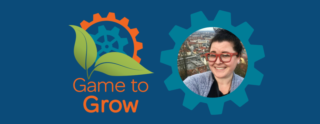 Game to Grow logo and a sprocket frame. Photo inside the frame is of a woman with dark hair in a bun smiling at the camera. An old city is behind her, most of the buildings have red roofs.